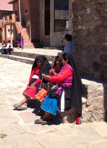 local women sitting in the main square