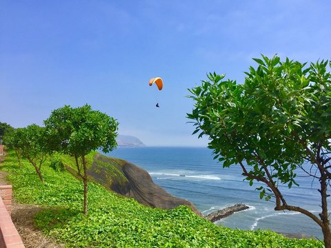 Paragliding over coast in Miraflores Lima Peru