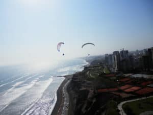 People paragliding Lima on the Miraflores green coast