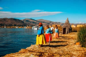 Uros Island locals Lake Titicaca tours Puno Peru Bolivia Border
